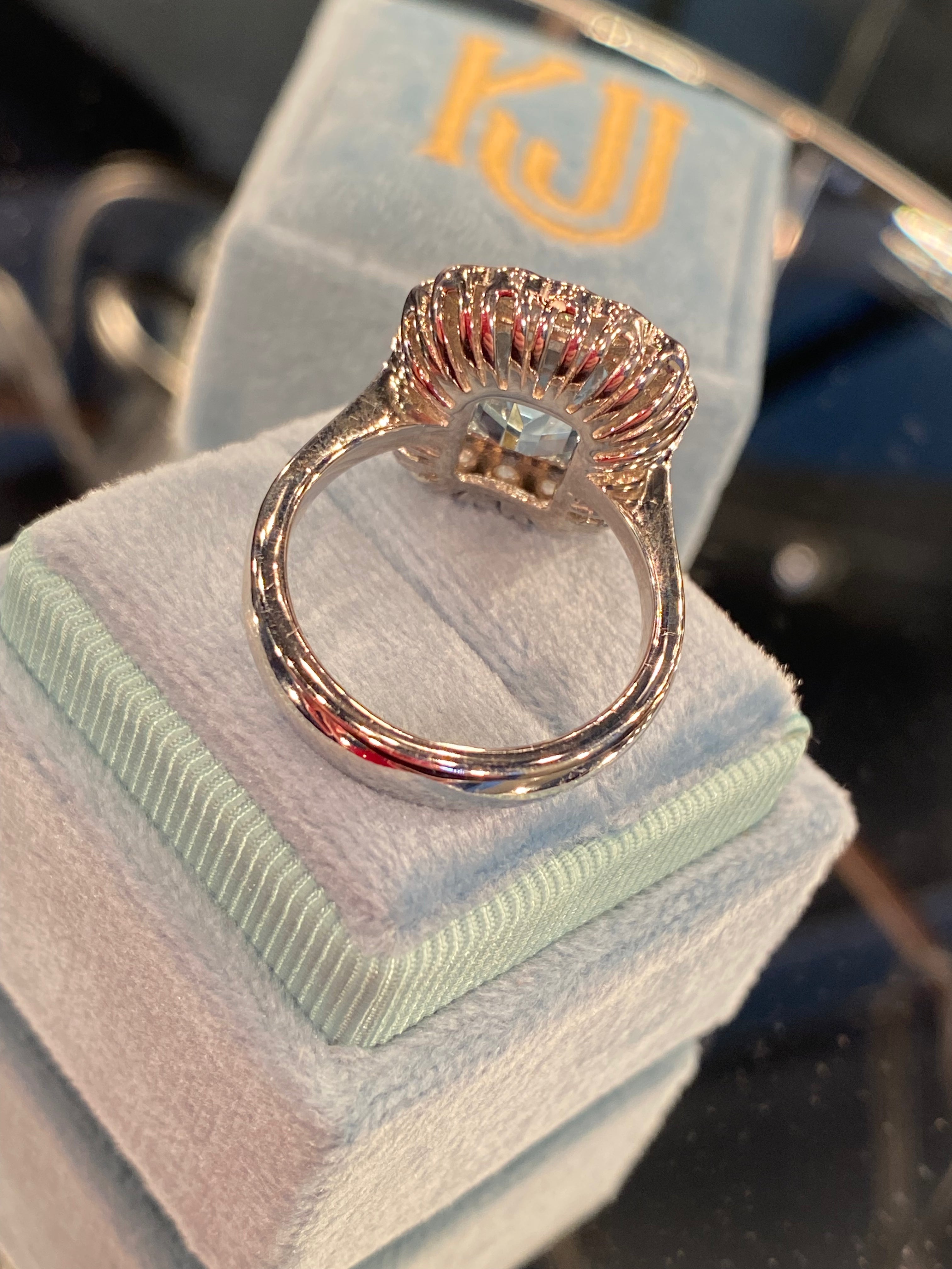 4.25 CTW Emerald Cut Blue Topaz and Moissanite Halo Cocktail Ring
