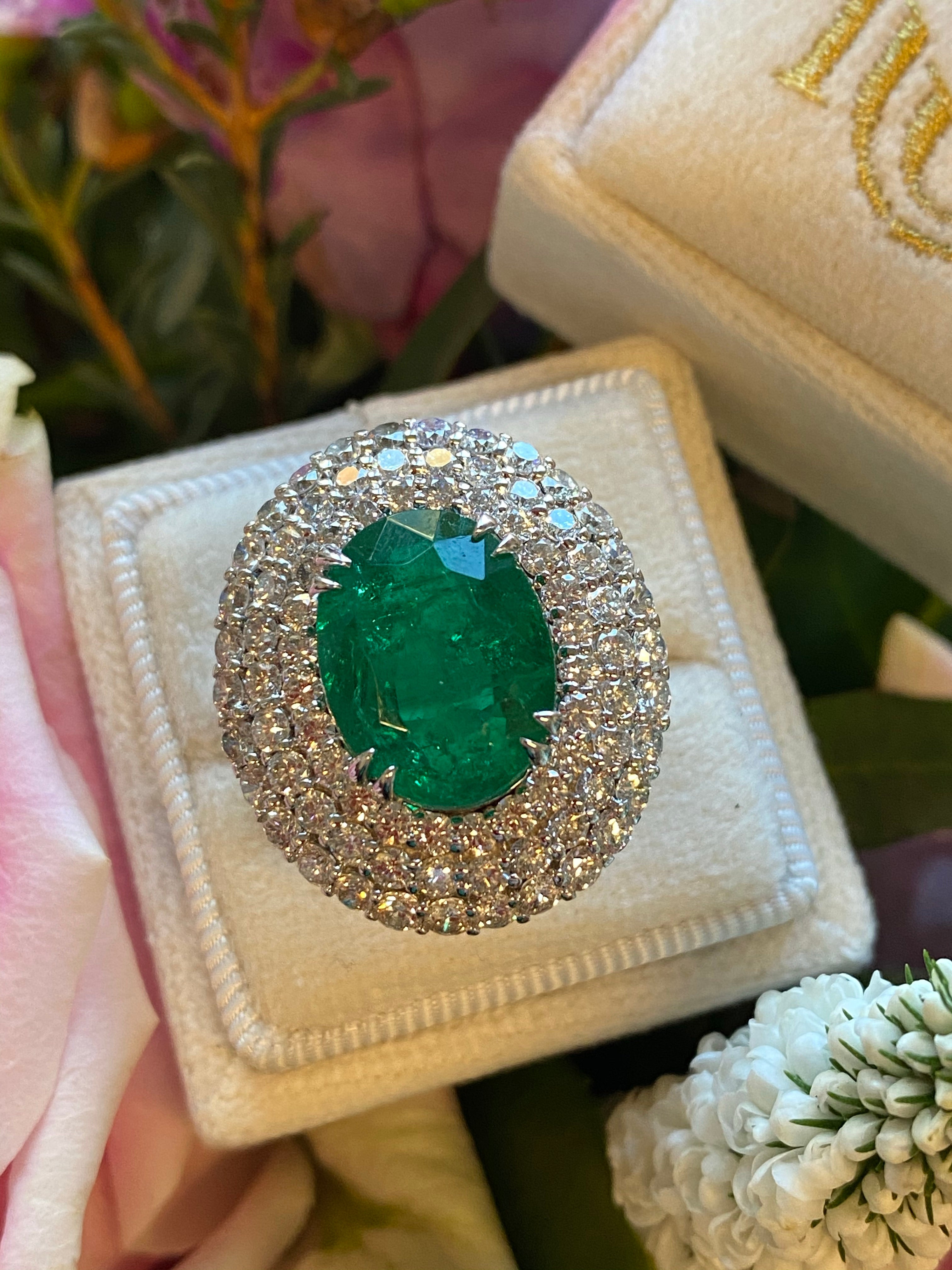7 Carat Oval Cut Emerald and Triple Diamond Halo Engagement Cocktail Ring in Platinum 