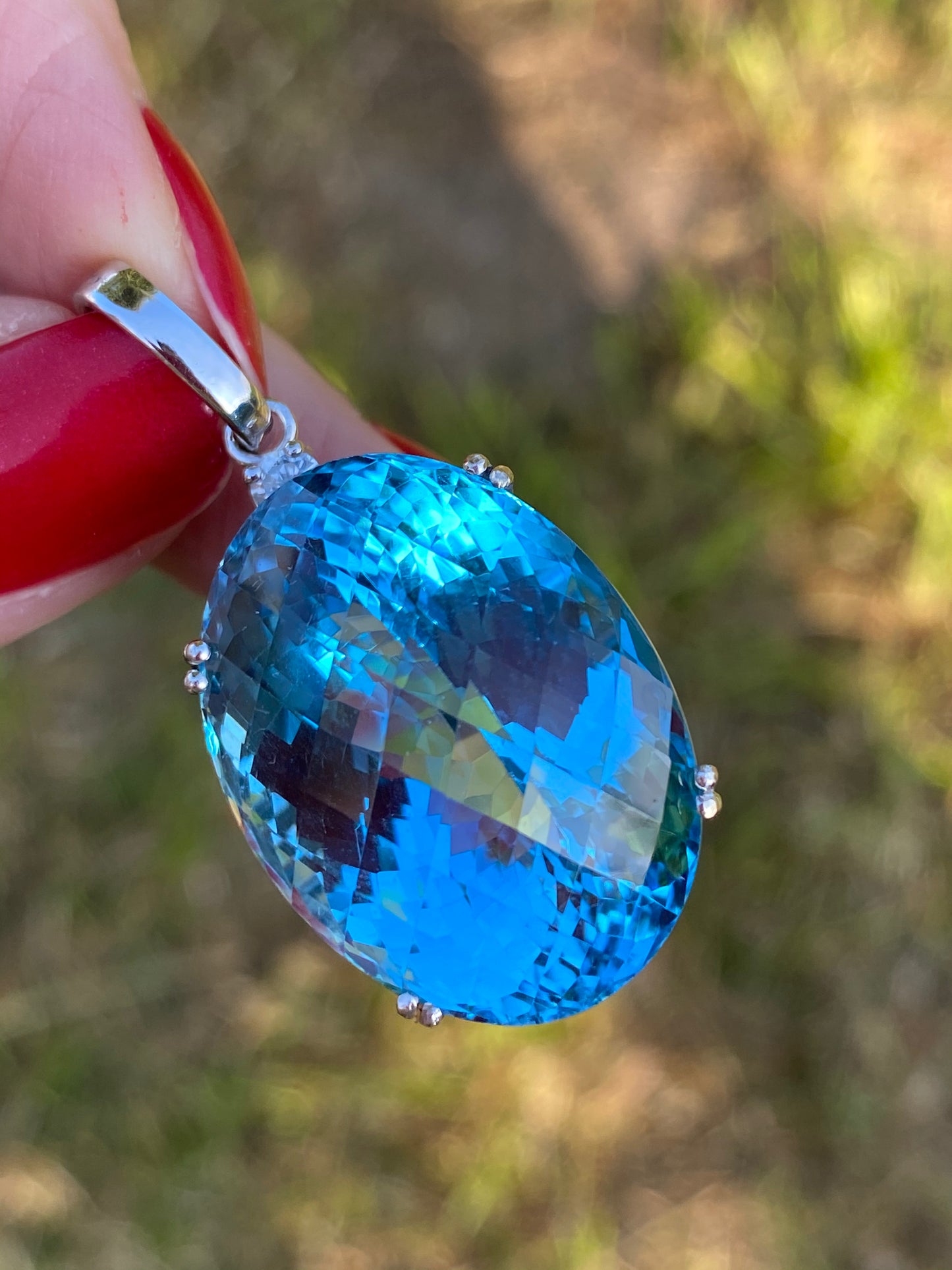 50 Carat Oval Blue Topaz and Diamond Necklace Pendant in 18K White Gold