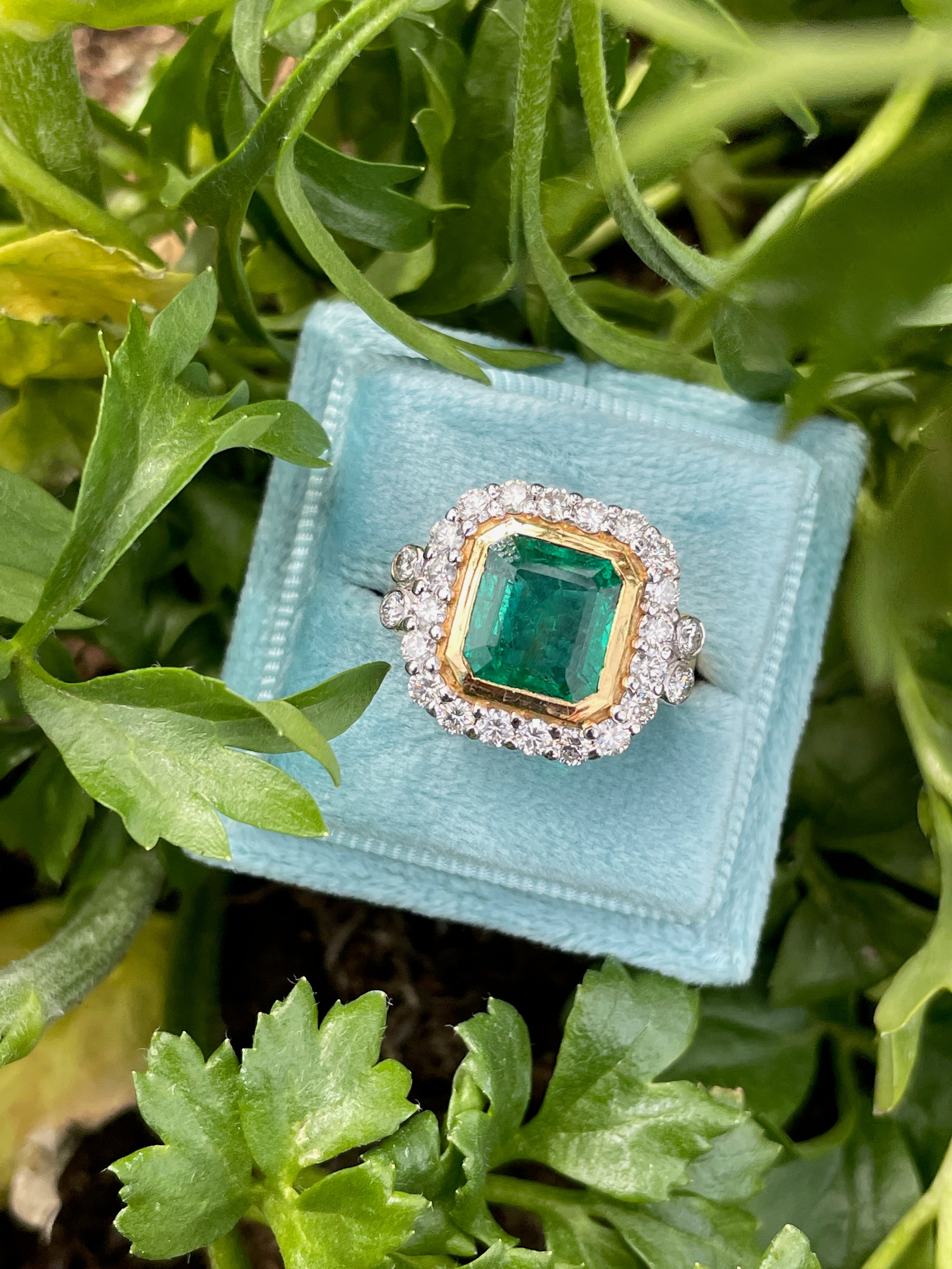 3 Carat Emerald and Diamond Halo Bezel Set Cocktail Engagement Ring in White and Yellow Gold 