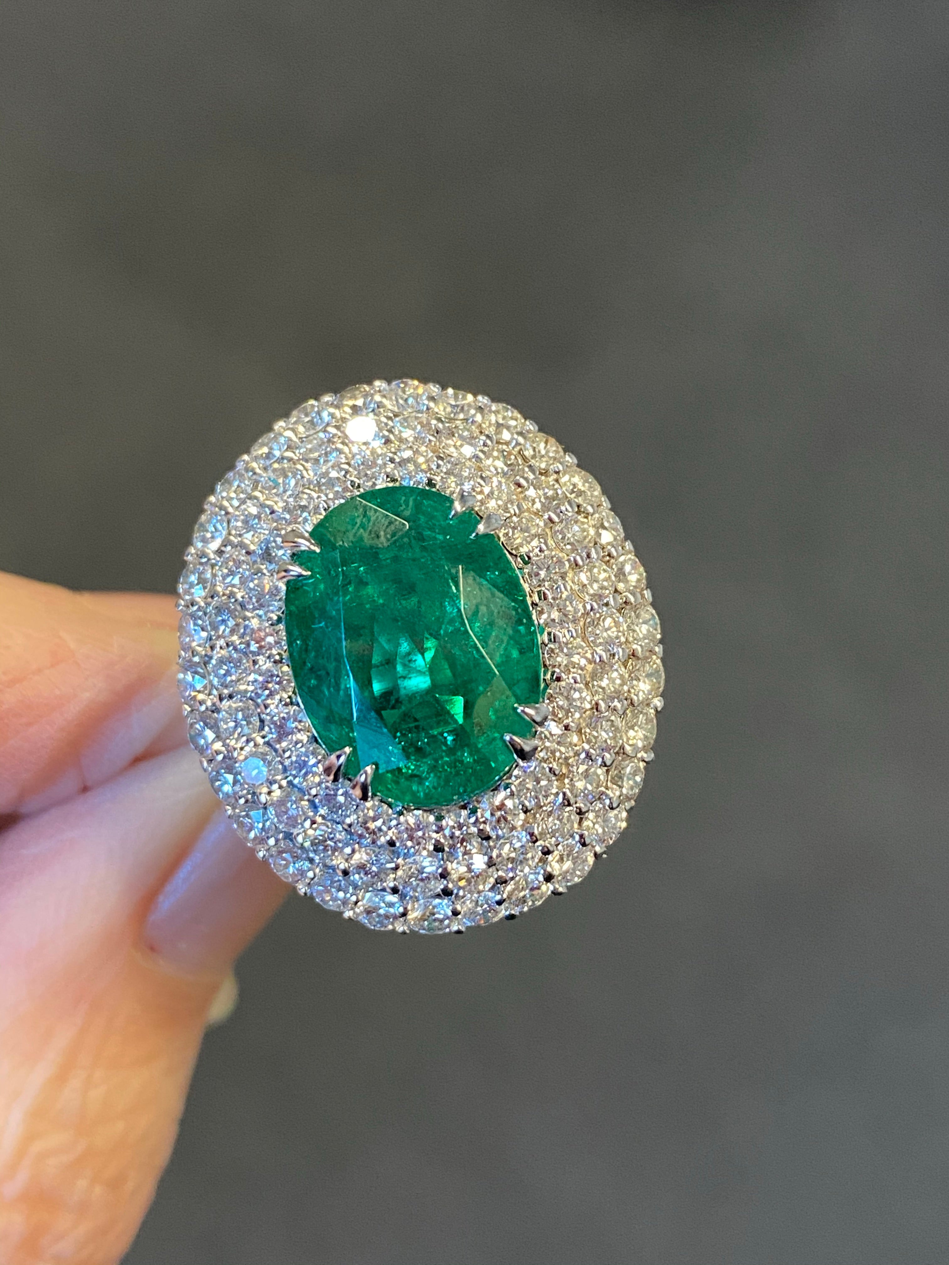 7 Carat Oval Cut Emerald and Triple Diamond Halo Engagement Cocktail Ring in Platinum 