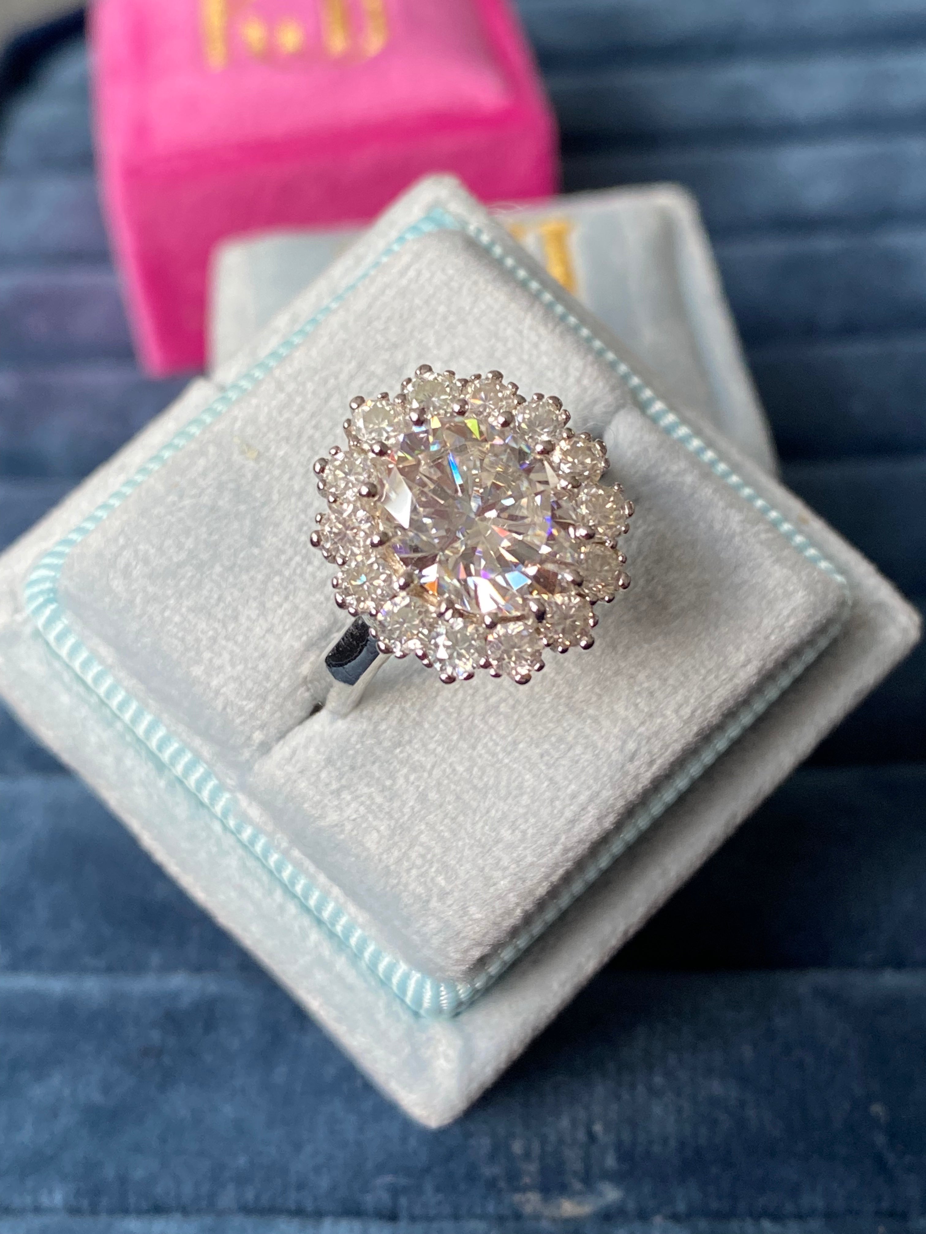 Oval Moissanite Halo Engagement Ring in Sterling Silver 