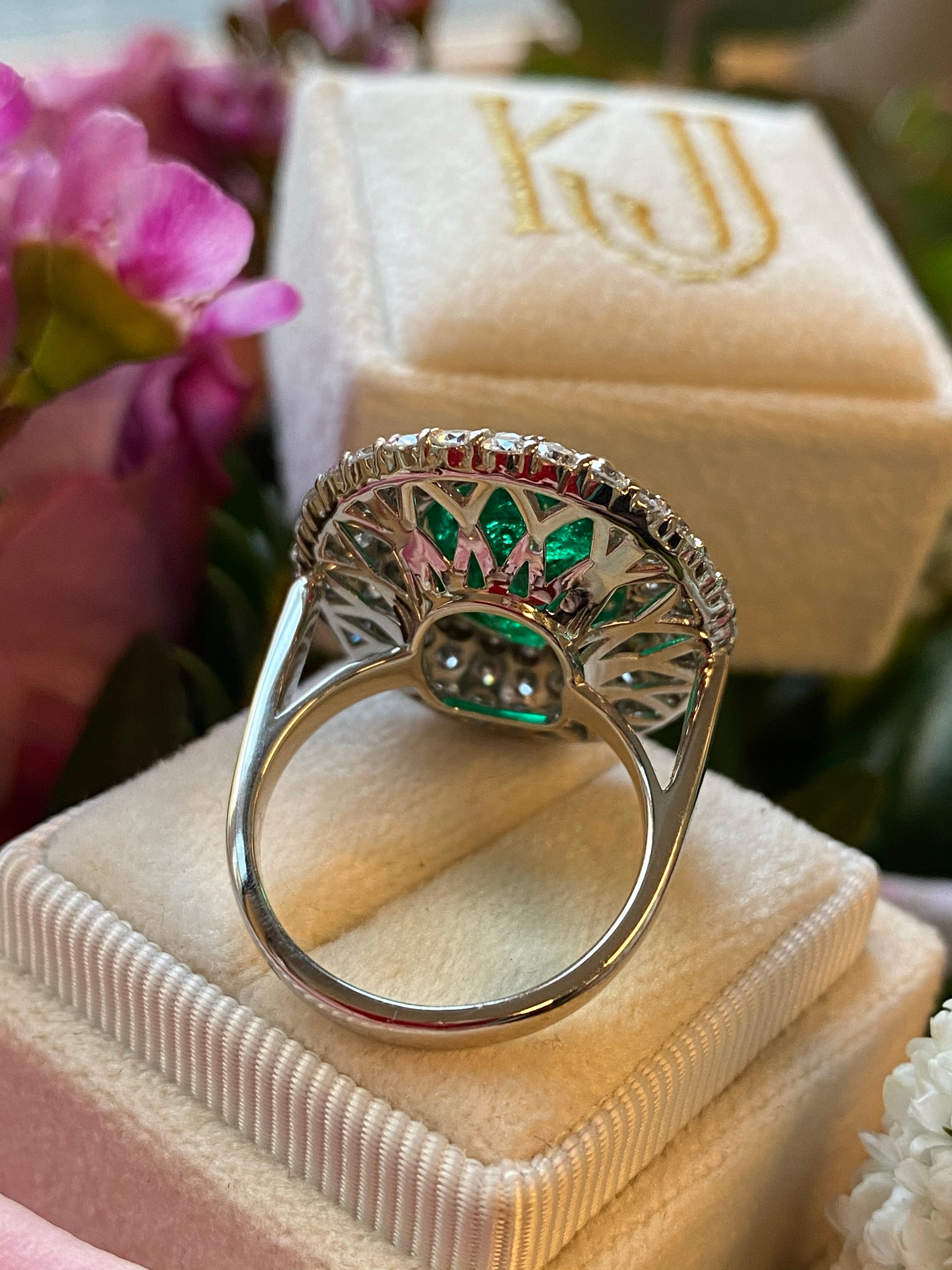 7 Carat Oval Cut Emerald and Triple Diamond Halo Engagement Cocktail Ring in Platinum 